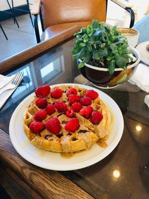 Waffle, almond butter, maple syrup and fresh raspberries.