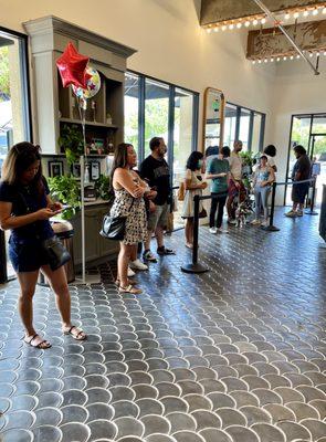 The slowly moving line for coffee.