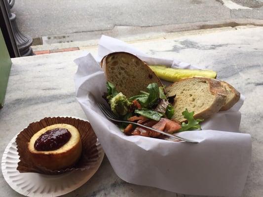 Pesto and tomato on sourdough with a side salad and raspberry cheesecake.