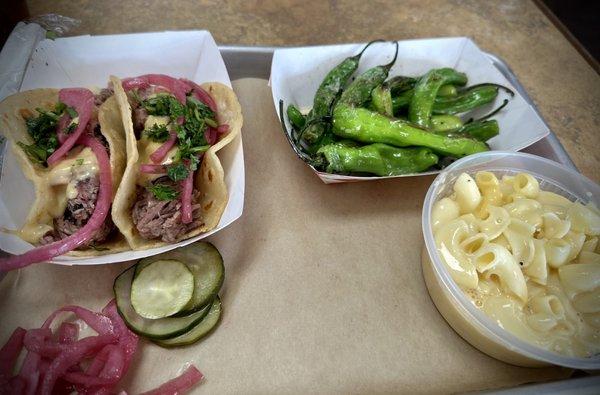 Brisket tacos, Shishito peppers, Mac n cheese, with house made pickles and onions.