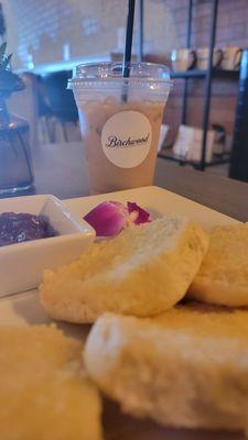 Buttered biscuits and jam with an Iced white tuxedo latte