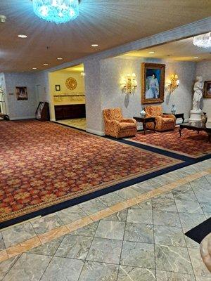 View from hallway toward front lobby/elevator to garage