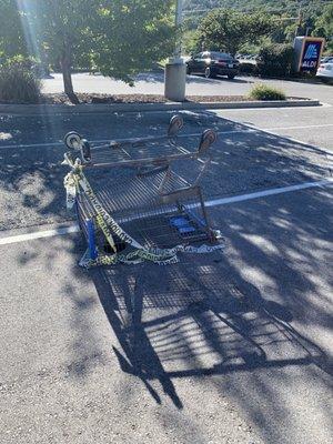 Overturned carts to prevent parking on massive potholes