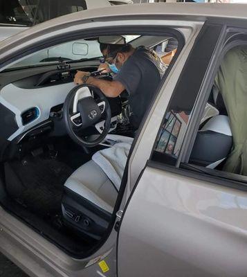 Ozzie installing head unit of Toyota Prius Prime