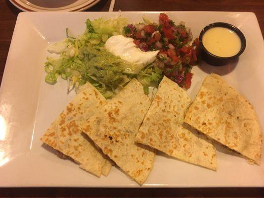 Quesadilla, pico, guacamole, sour cream, and cheese dip.