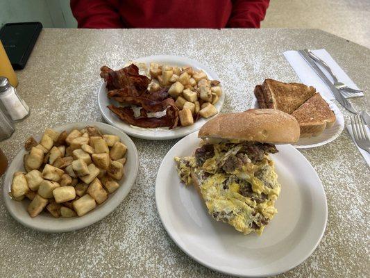 Sausage egg and cheese sandwich with home fries and two eggs with bacon and home fries SUPER YUMMY