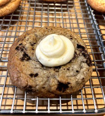 C.R.E.A.M! Double stuffed Oreo based cookie w/ cream cheese frosting.