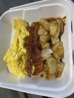 Bacon breakfast platter with eggs and home fries.