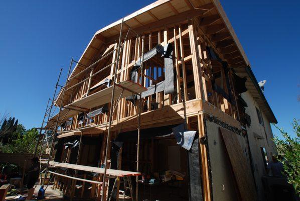 Second story room addition framing, rough electric and plumbing and concrete