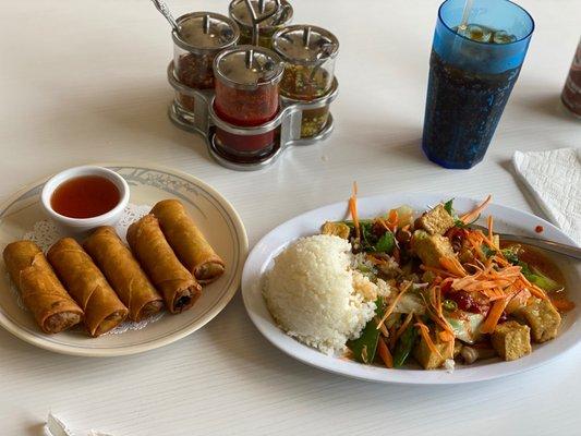 Veggie eggrolls with sauce. Veggie tofu with rice and canned soda root beer