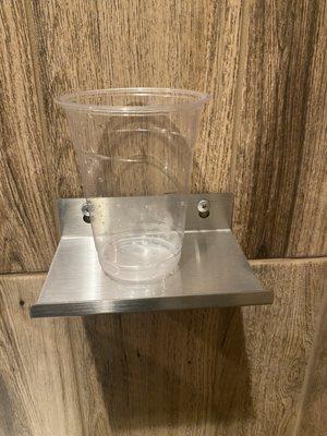 Shelf for your glass, while using the restroom.