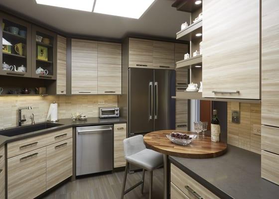 Urban style kitchen with textured melamine cabinetry, quartz countertops, solid walnut eating counter