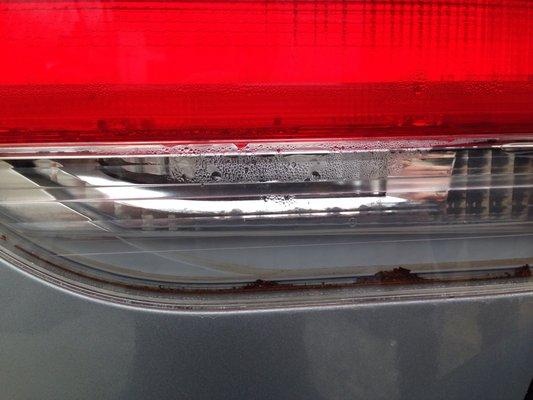 Water in tail light and rust flecks