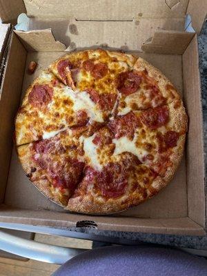 A pepperoni pizza with extra cheese.