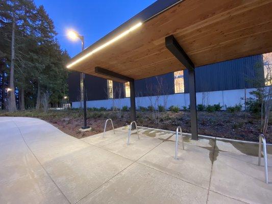 Nice covered- outdoor bike parking  And they have outdoor pickle ball courts- you can see in the background!