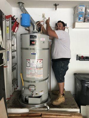 Alonzo finishing up a water heater