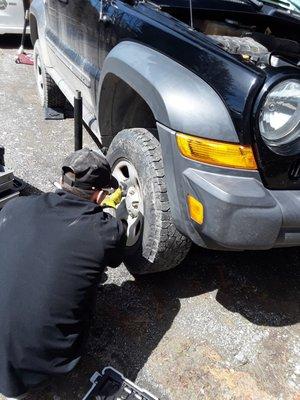 Finishing brakes on a Jeep Liberty at the customer's home!