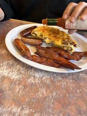 Cowboy omelet side of sausage and side of bacon