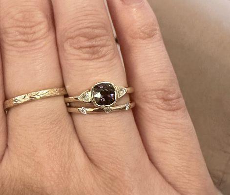 Custom Ring: 14kt yellow gold, with bezel set cushion cut purple spinel and bezel set trillion cut diamonds.