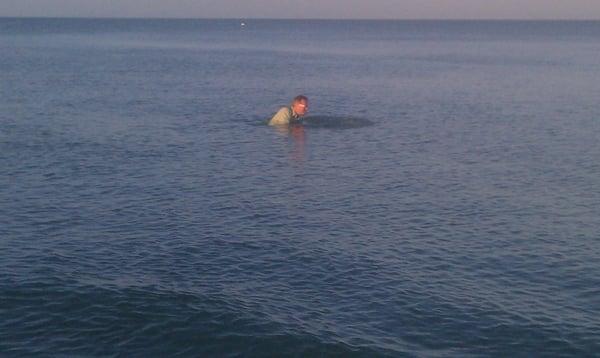 Faithful receives full immersion baptism folllowed by applause