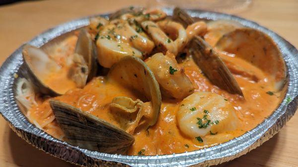 Seafood special - shrimp, clams, scallops, calamari with vodka sauce over angel hair pasta