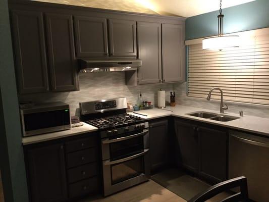 Darrin also had the brilliant idea of adding crown moulding to the tops of our cabinets. We love how they turned out.