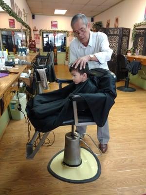 Baby boy getting his hair cut