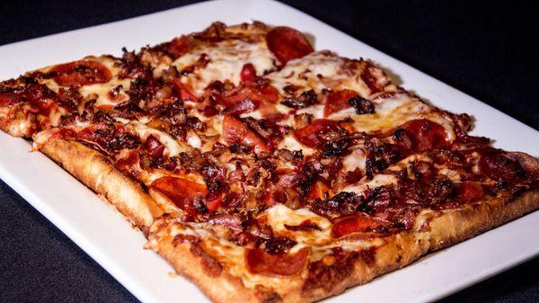 Our famous pizza with pepperoni and crisp bacon