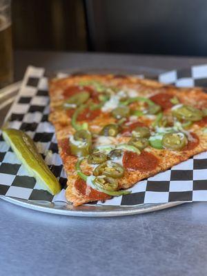 *G SLICE- PEPPERONI with green peppers, jalapeños and a Dallas Blonde.