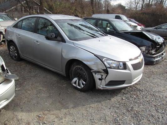 2011 Chevy Cruz before repairs picture. This car was hit on front  and rear end damage on the passenger side.