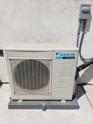 Here is the Daikin system they installed outside. It's small and mega quiet.