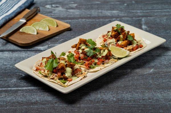 BBQ mahi tacos with grilled flour tortillas, Cabo slaw, Southwest bbq sauce, lime cream sauce & pico de Gallo.