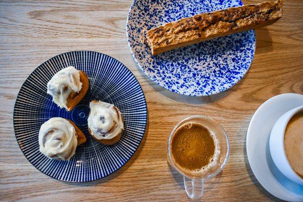 House made biscotti, cinnamon roll bites, and a macchiato.