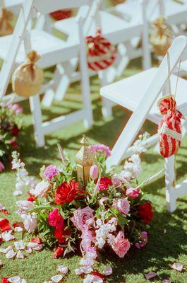 Unique arrangement designed around a tall lantern - used both as ceremony aisle pieces and center pieces at my reception