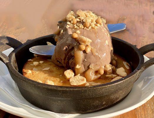 Served HOT Fresh baked in iron skillet Vanilla butter cake with Pittsford dairy chocolate ice cream topped with lots of nuts