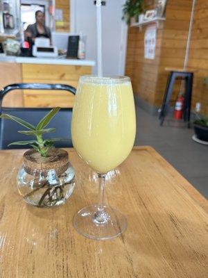 Mango, pineapple and oat milk smoothie.