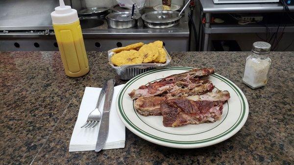 Costillas and tostones, $10 together (not including tup), perfect.