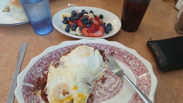 Eggs over corned beef hash.