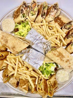 Wraps Tray: Chicken Shawarma, Beef Shawarma, Falafel, Beef Gyro, and our house sauces