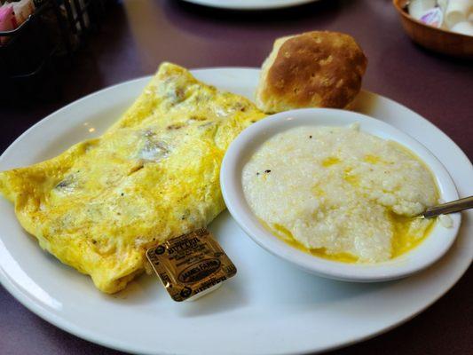 Meat lovers omelet, grits and biscuit