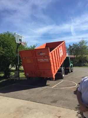 Vue dropping off the dumpster.