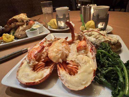 Lobster with loaded baked potato.