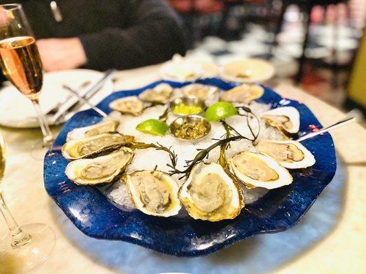 Canadian Oysters with a vinaigrette sauce, cilantro horseradish sauce, fresh lime & Champagne. Excellent. :)...