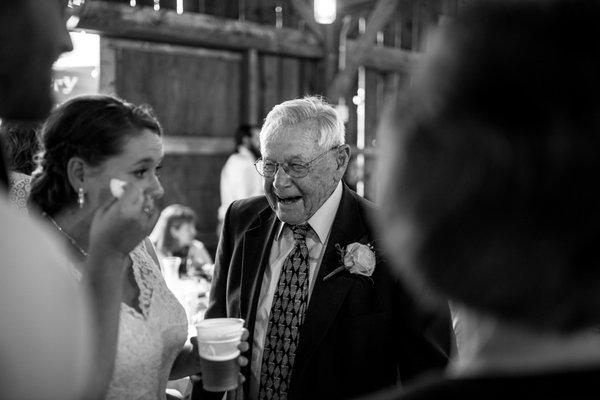 Bride crying while talking with grandfather at the Justin Trails Resort in Sparta, WI.