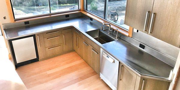 Stainless steel countertop with integrated pro series sink.