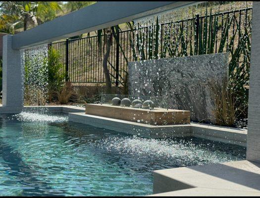 Fire and water feature overlooking a swimming pool in Orange County