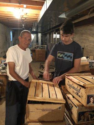 My dad and my son getting ready to start crushing the grapes