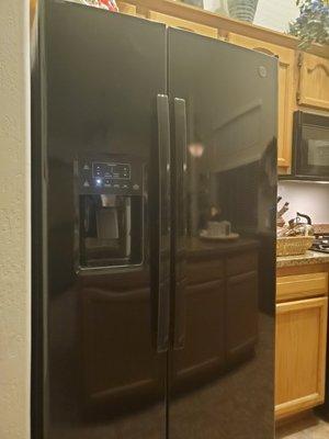 New GE refrigerator installed in kitchen