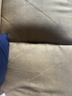 The sofa in the living room at MIDBLOCK CONDOMINIUM is Disgusting