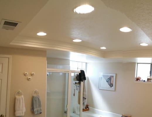 In this bathroom remodel, we installed recessed lighting, added crown moulding and installed a dimmer to save electricity!